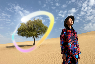 iPad Pro, front exterior display with dark blue and green gradient background with multiple apps open, hand holding Apple Pencil Pro circling a sketch showing Apple Intelligence Image Wand feature