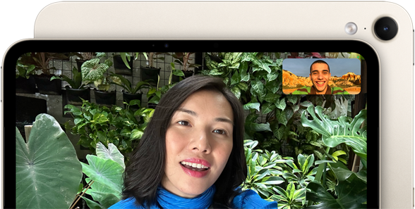 iPad mini, front view, displaying a Landscape 12MP Center Stage front camera interface, showing a person video calling amidst green foliage