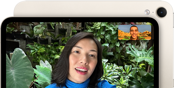 iPad mini, front view, displaying a Landscape 12MP Center Stage front camera interface, showing a person video calling amidst green foliage