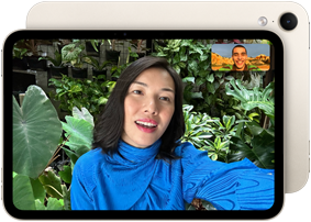 iPad mini, front view, displaying a Landscape 12MP Center Stage front camera interface, showing a person video calling amidst green foliage