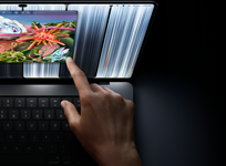 MacBook Pro met PROLED XDR-display, kleur spacezwart, gebruiker past met een vinger de grootte van een venster aan