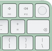 Rechterbovenhoek van Magic Keyboard in de kleur groen, Touch ID, Delete-toets en volumetoetsen