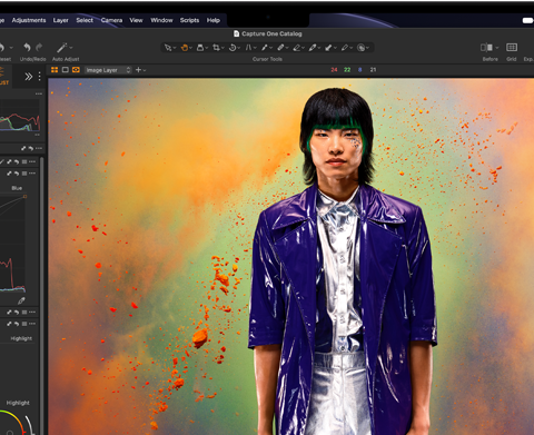 MacBook Pro screen of a photo of a person being edited in Capture One